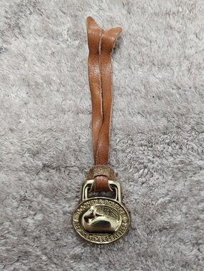 🦆 Dooney & Bourke Solid Brass Leather Hang Tag Bag Charm Vintage 🦆